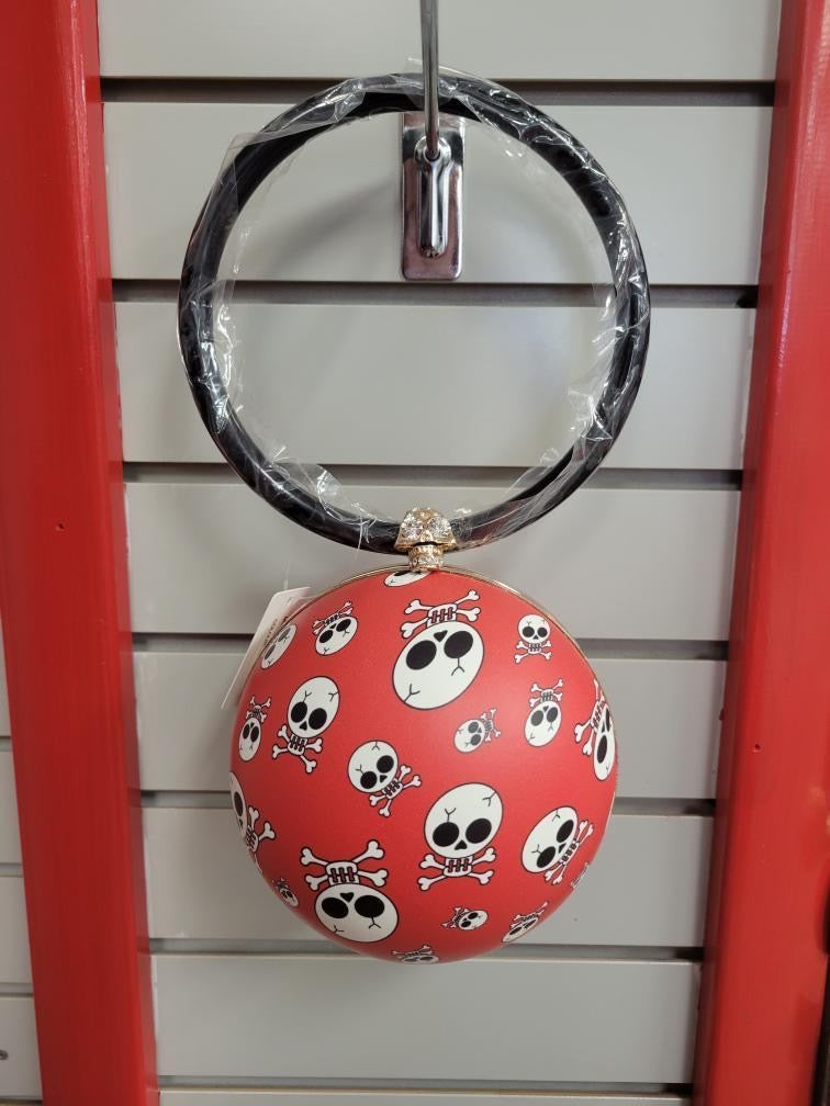 Ball shaped purse with skull and crossbones